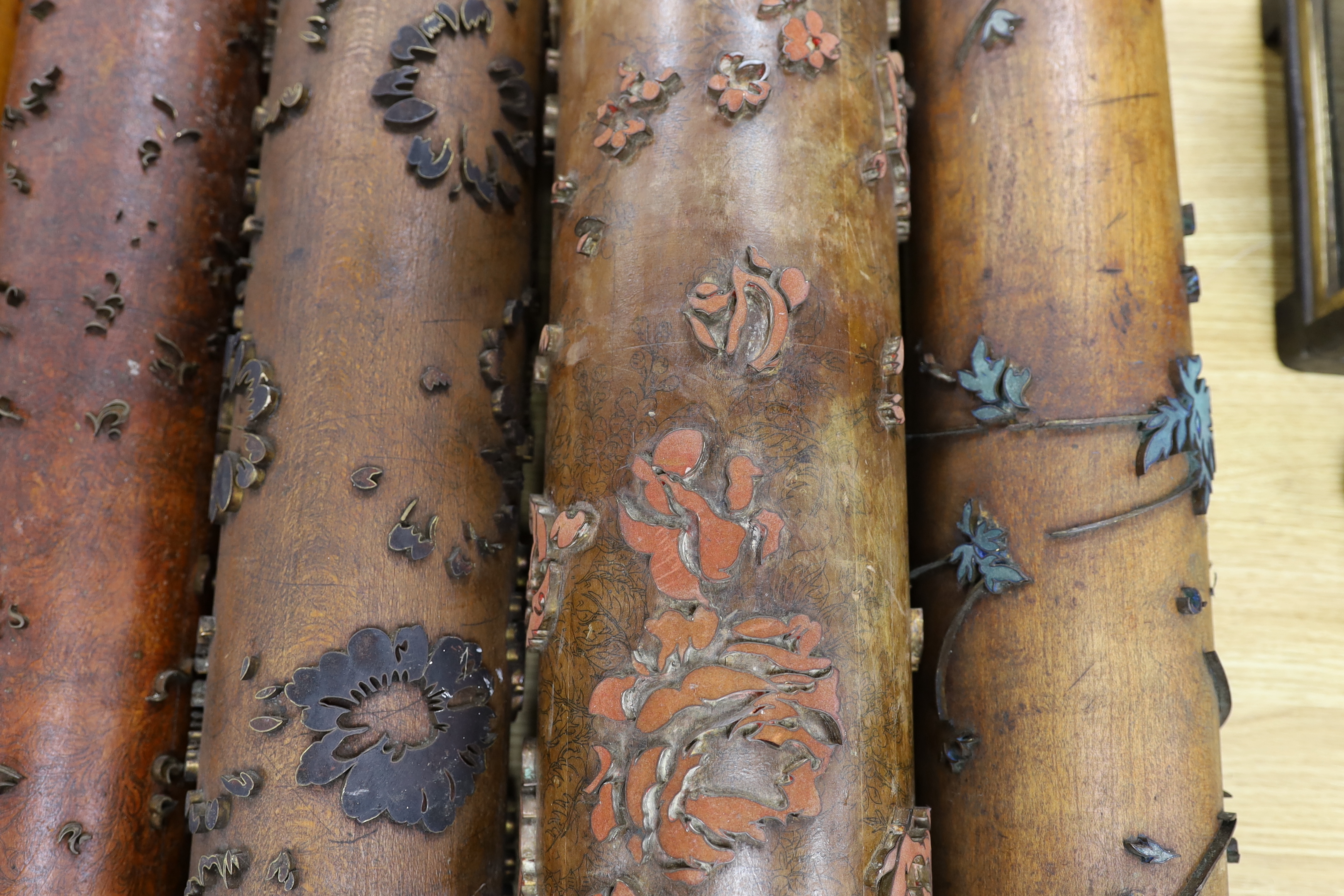 Five USA wooden print rollers for wallpaper, late 19th century, including a UWPC (United Wall Paper Craftsmen of North America) example, another stamped with serial numbers, longest 60.5cm